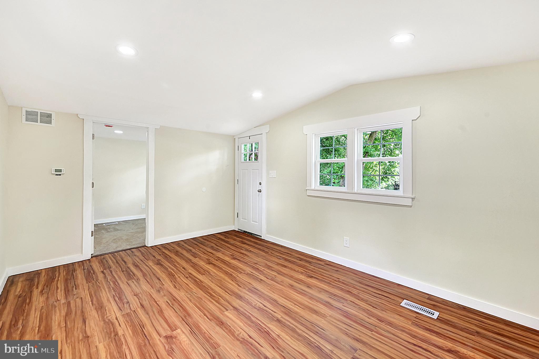 215 Freysville Road York, PA 17406 - Photo 10 of 19 a view of empty room with wooden floor and fan