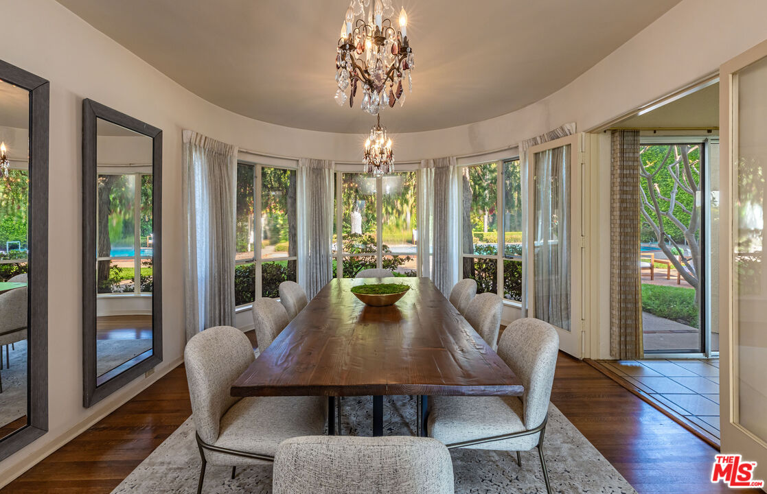 540 Adelaide Drive Santa Monica, CA 90402 - Photo 12 of 45 a view of a dining room with furniture wooden floor and chandelier