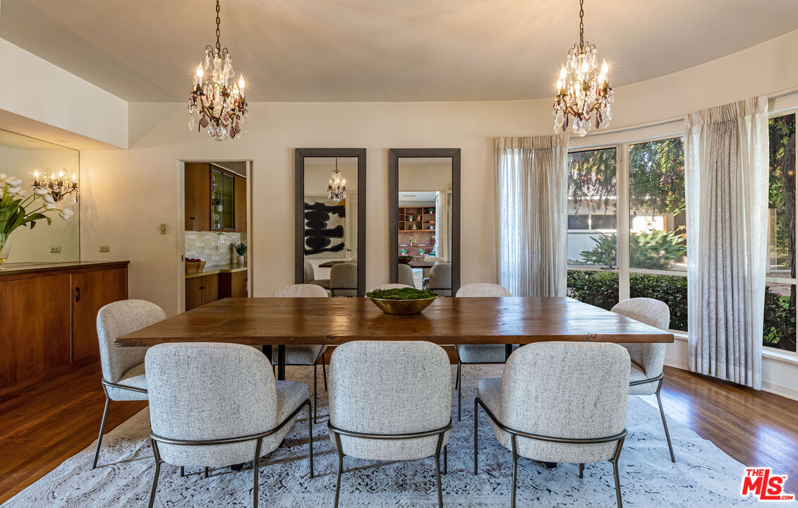540 Adelaide Drive Santa Monica, CA 90402 - Photo 13 of 45 a dining room with furniture a chandelier and wooden floor