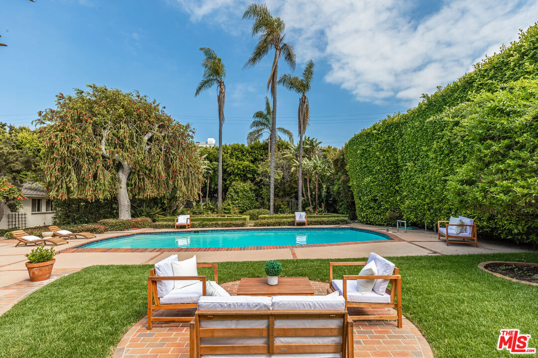 540 Adelaide Drive Santa Monica, CA 90402 - Photo 15 of 45 a view of backyard with swimming pool and outdoor seating