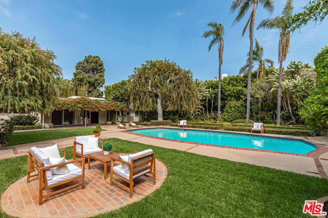 540 Adelaide Drive Santa Monica, CA 90402 - Photo 16 of 45 a view of a house with swimming pool and sitting area