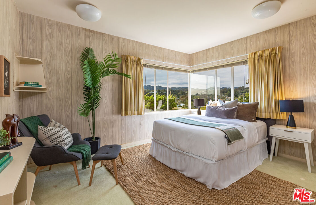 540 Adelaide Drive Santa Monica, CA 90402 - Photo 25 of 45 a bedroom with a large bed and a large window