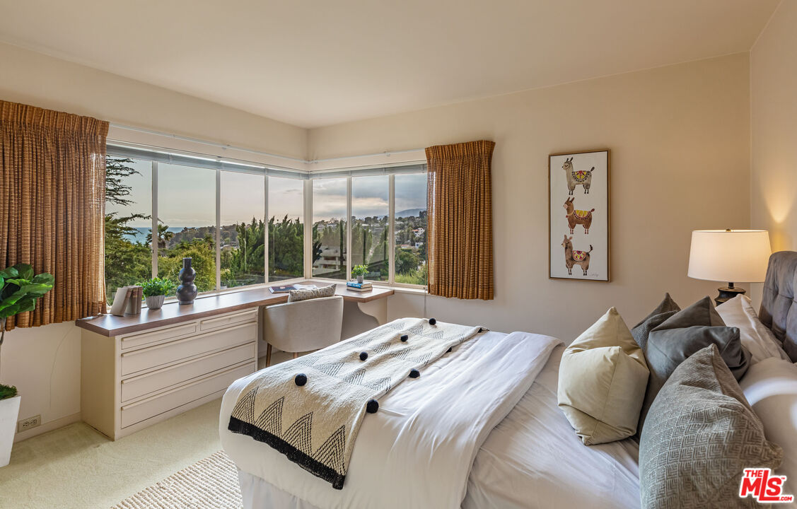 540 Adelaide Drive Santa Monica, CA 90402 - Photo 27 of 45 a bed sitting in a bedroom next to a window