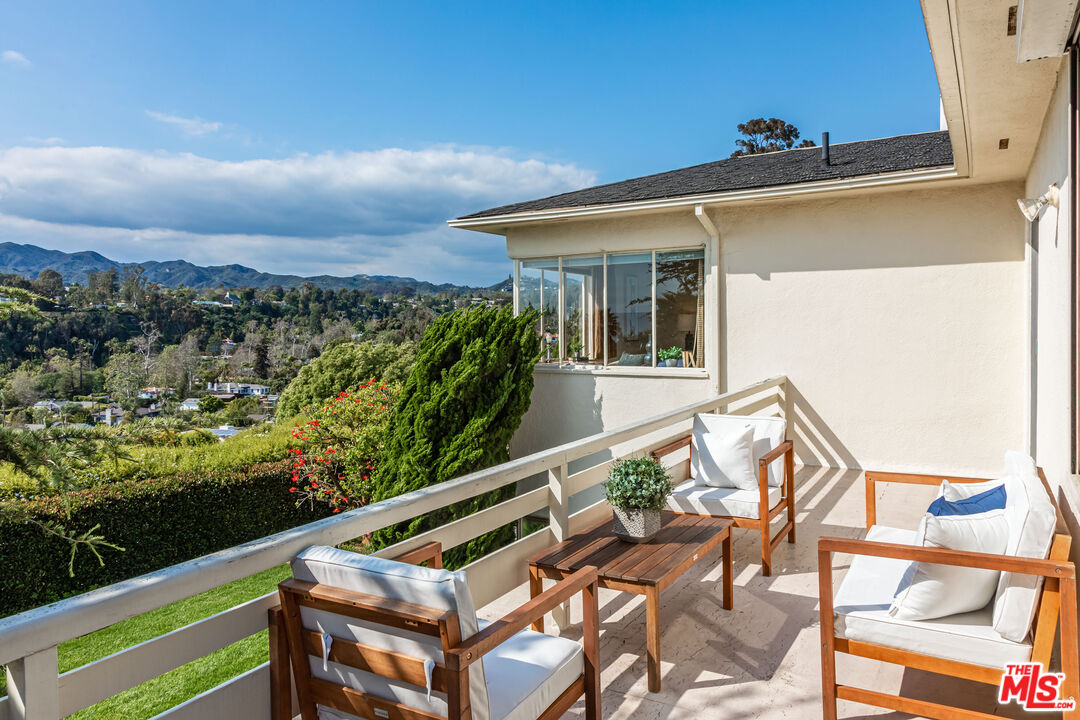 540 Adelaide Drive Santa Monica, CA 90402 - Photo 30 of 45 a view of a balcony with two chairs and a table