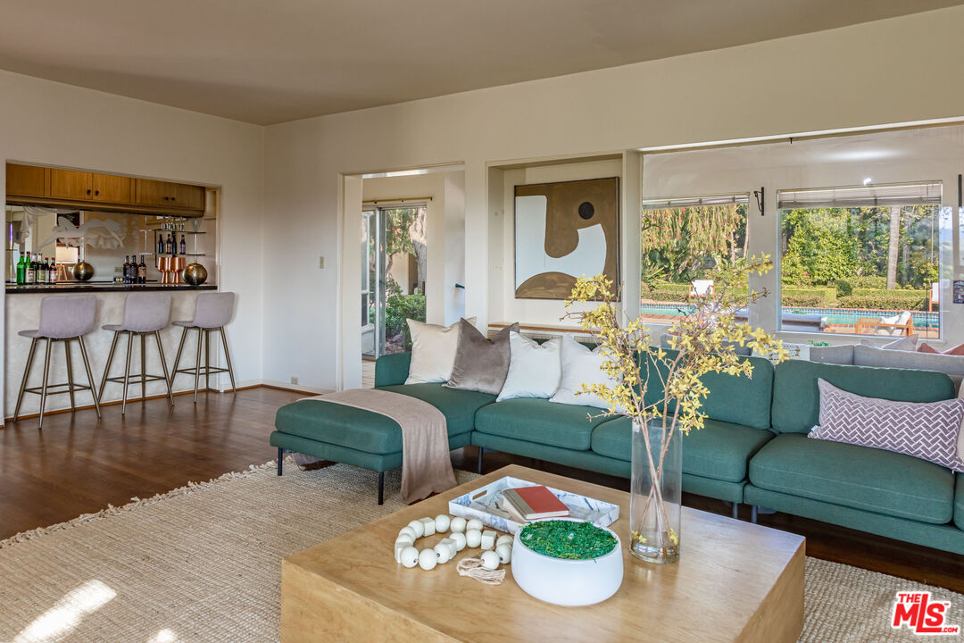 540 Adelaide Drive Santa Monica, CA 90402 - Photo 3 of 45 a living room with furniture and a wooden floor