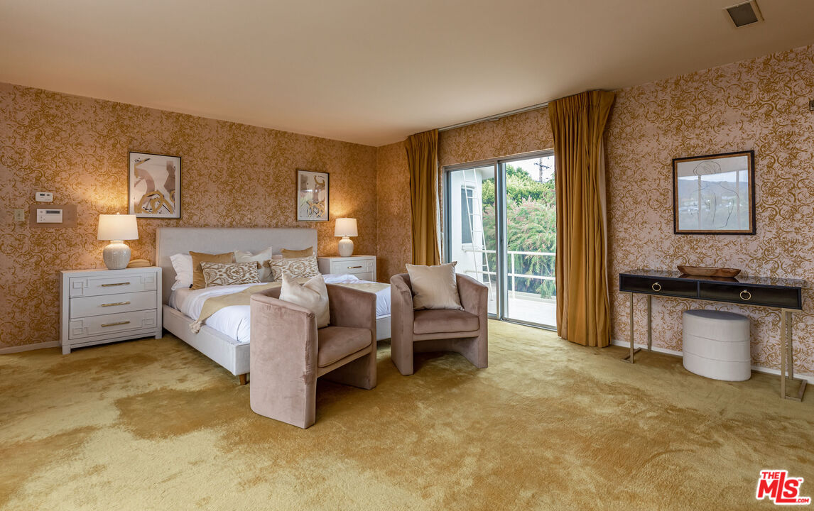 540 Adelaide Drive Santa Monica, CA 90402 - Photo 35 of 45 a spacious bedroom with a bed and large windows