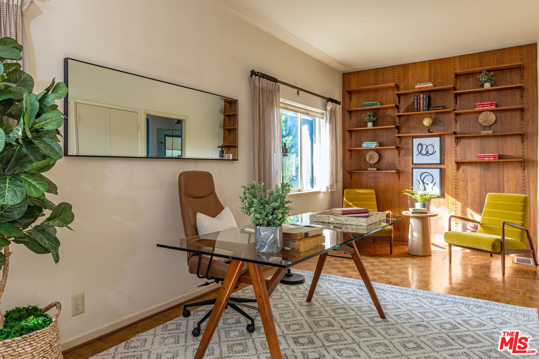 540 Adelaide Drive Santa Monica, CA 90402 - Photo 4 of 45 a workspace with furniture and wooden floor