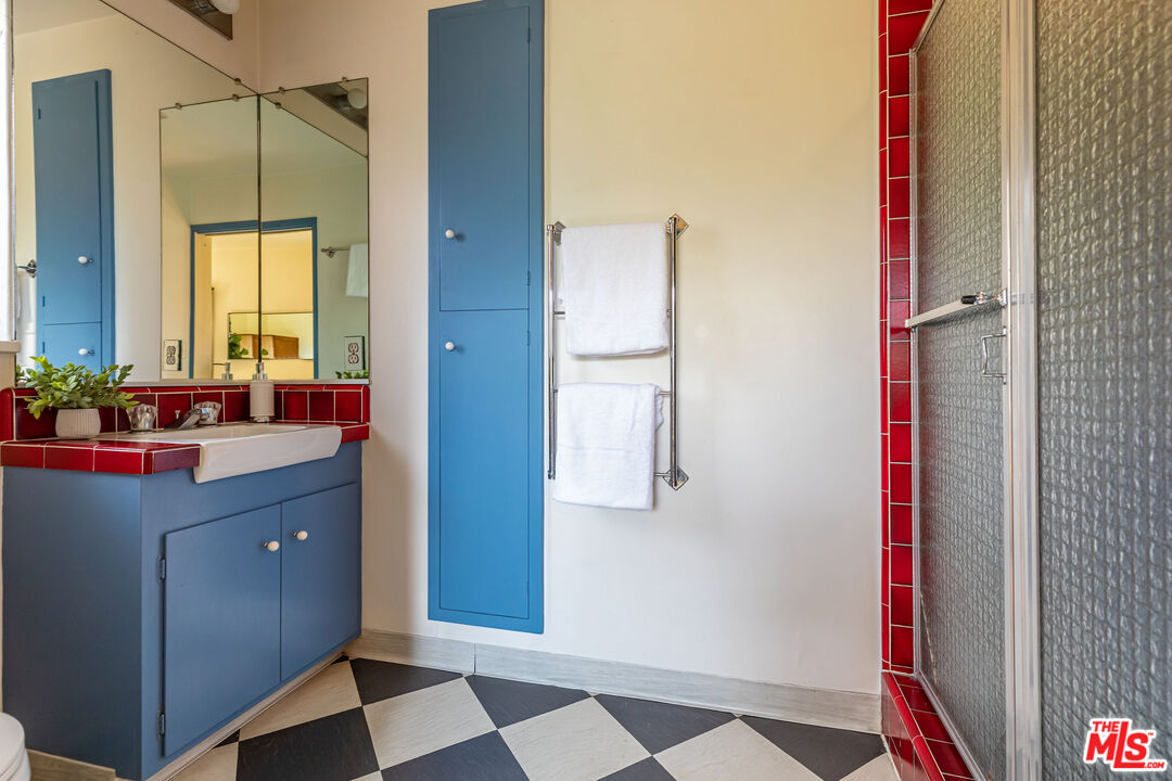 540 Adelaide Drive Santa Monica, CA 90402 - Photo 8 of 45 a room with a sink and a mirror