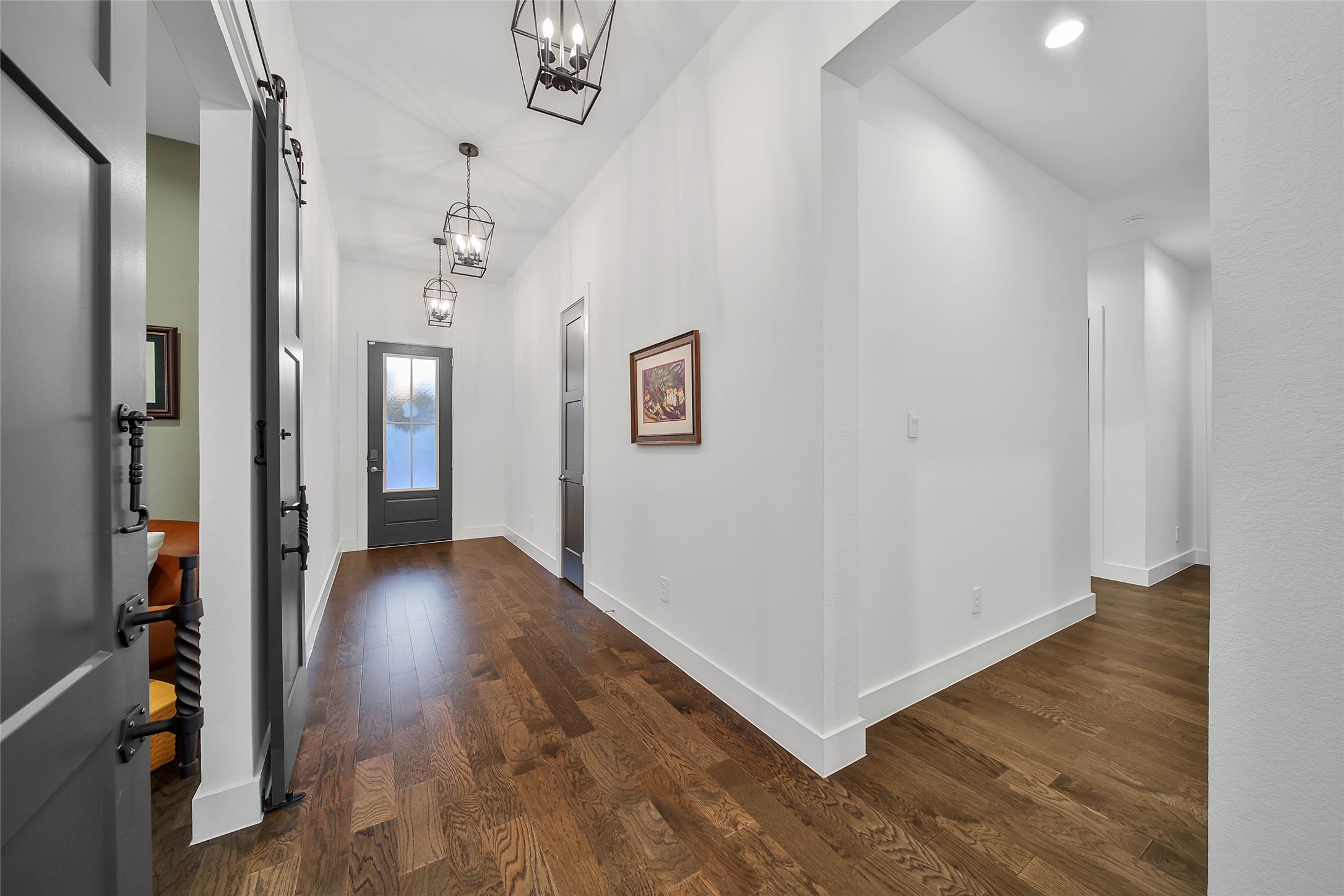 1015 Oak Briar Lane Conroe, TX 77384 - Photo 8 of 50 a view of a hallway with wooden floor and closet