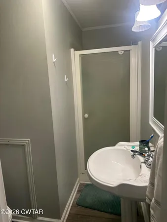 a bathroom with a sink and mirror