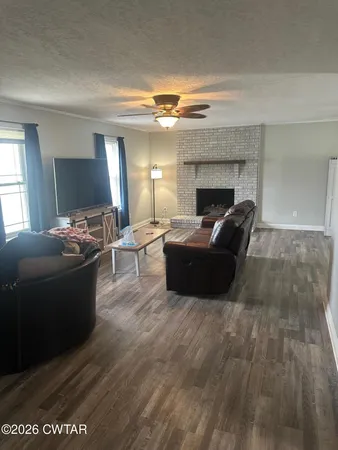 a living room with furniture and a fireplace