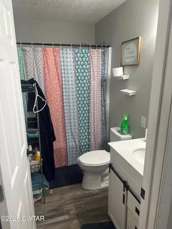 a bathroom with a sink and toilet