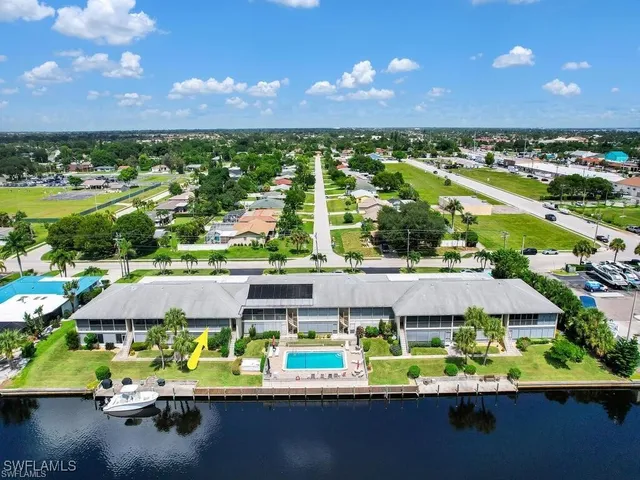 a view of a lake with a house in the background