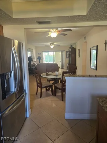 a bedroom with a bed and a mirror