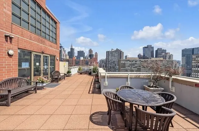 a view of a terrace with furniture and a potted plant