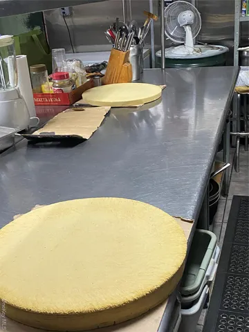 a view of a patio with table and chairs with wooden floor