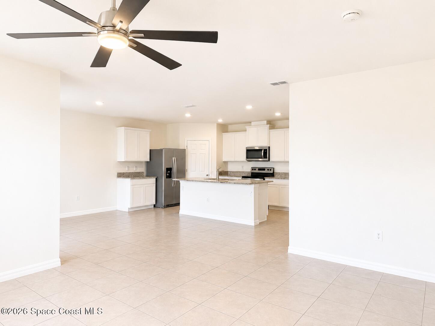 3659 Foggy Mist Road Southeast Palm Bay, FL 32909 - Photo 10 of 22 living & kitchen