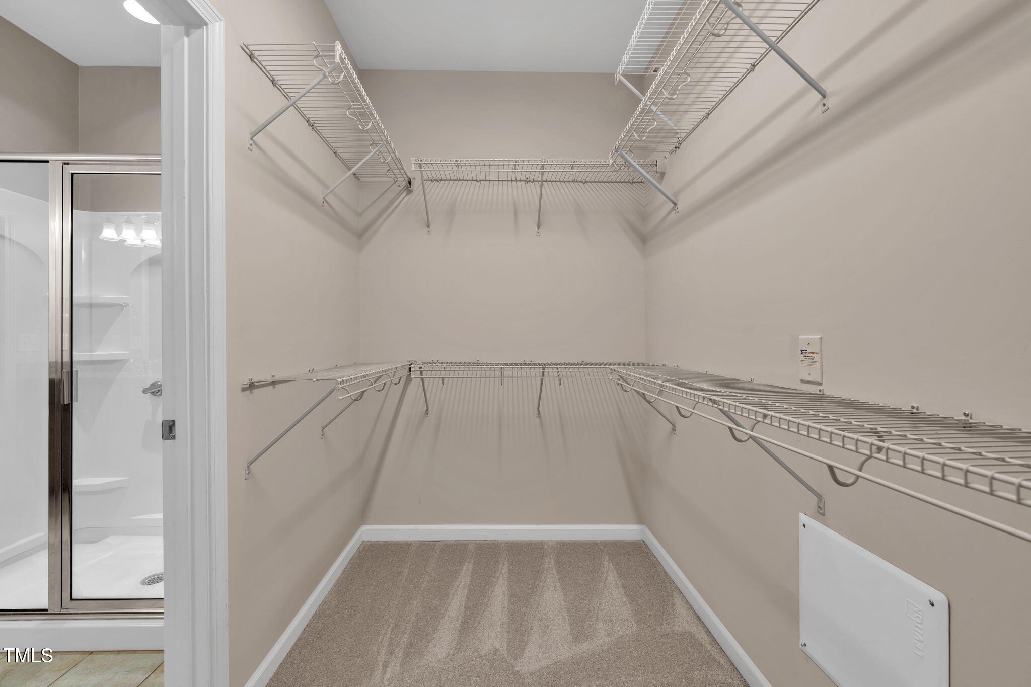 720 Finnbar Drive Cary, NC 27519 - Photo 31 of 55 a view of walk in closet with empty racks