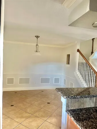 a view of an empty room with glass door