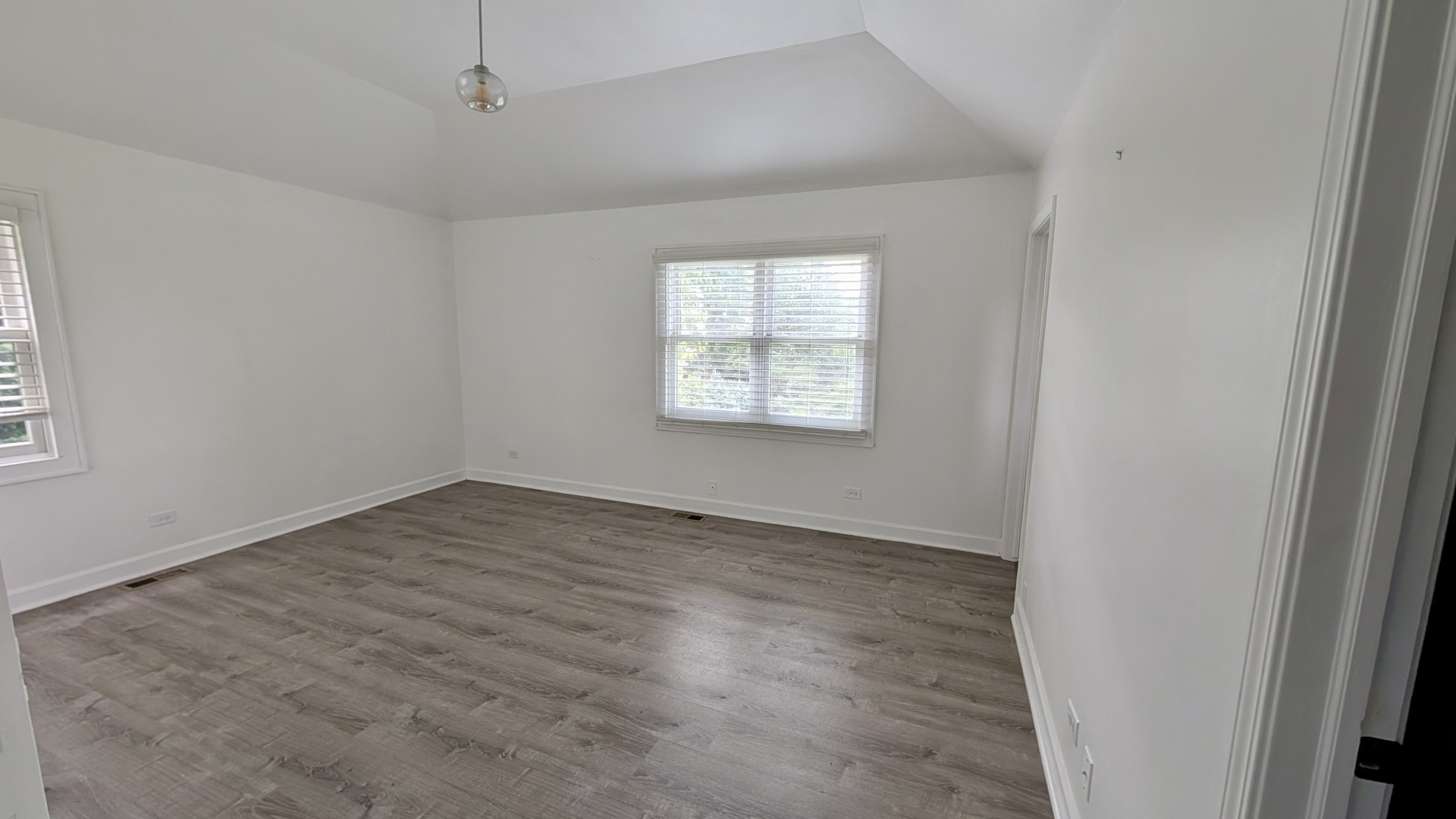 11617 Hawthorne Way Huntley, IL 60142 - Photo 19 of 50 an empty room with wooden floor and windows