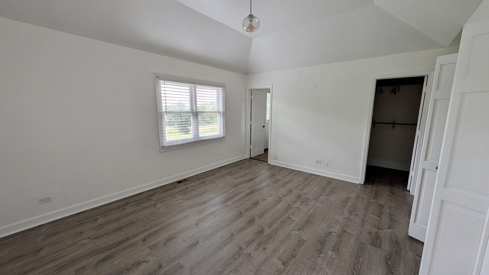11617 Hawthorne Way Huntley, IL 60142 - Photo 22 of 50 an empty room with wooden floor and windows
