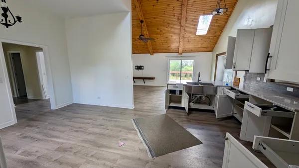 a view of a kitchen with furniture and window