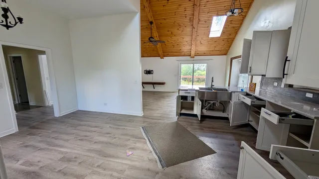 a view of a kitchen with furniture and window