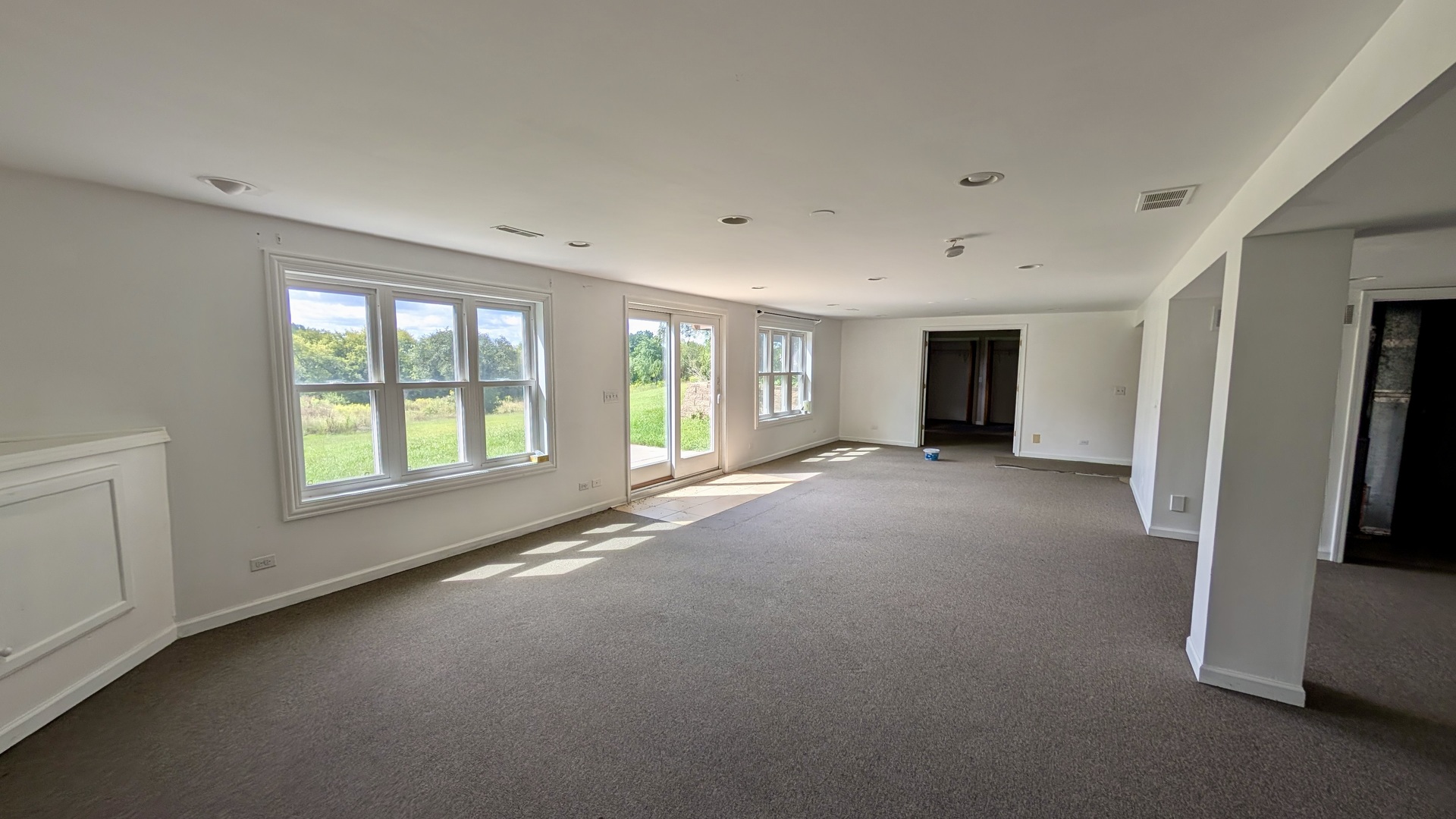 11617 Hawthorne Way Huntley, IL 60142 - Photo 33 of 50 a view of a livingroom with an empty space and a window