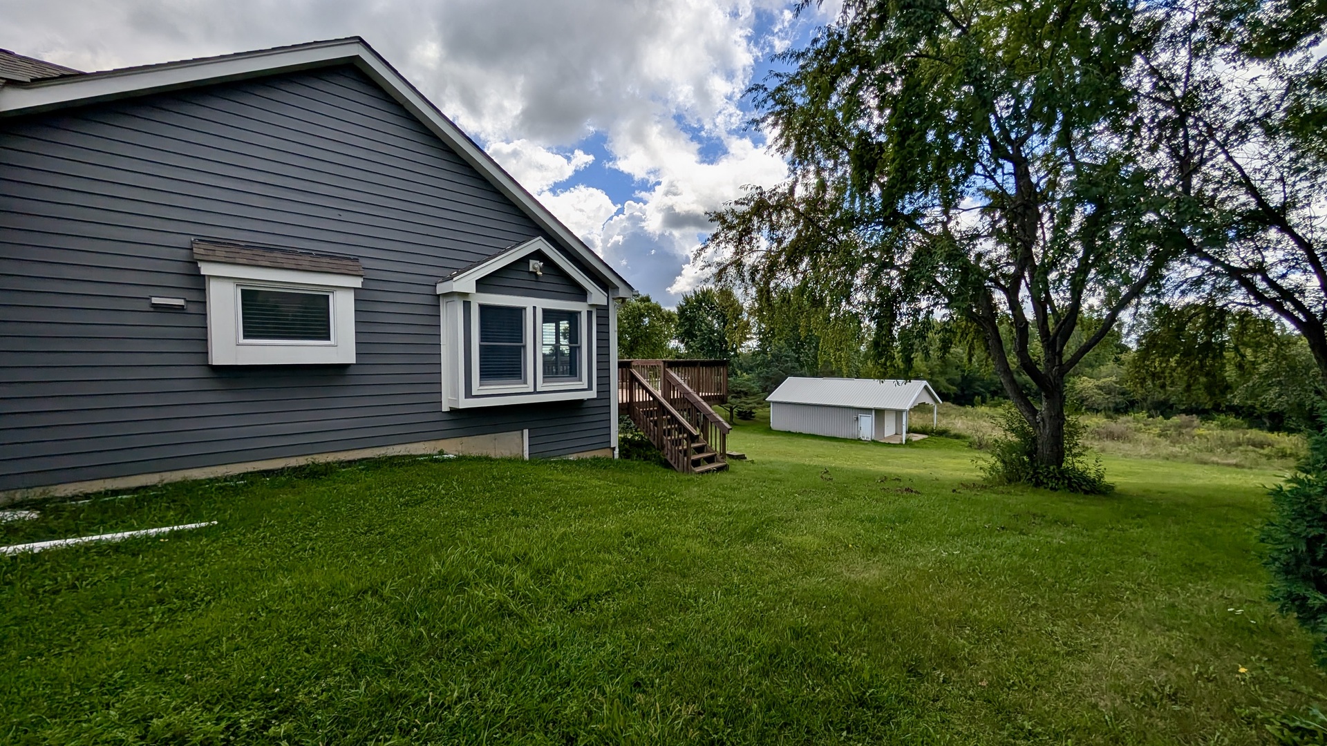 11617 Hawthorne Way Huntley, IL 60142 - Photo 37 of 50 a front view of a house with a garden