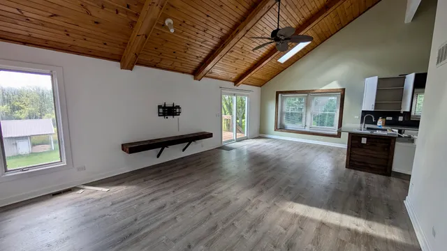 a living room with hard wood floors and a couch