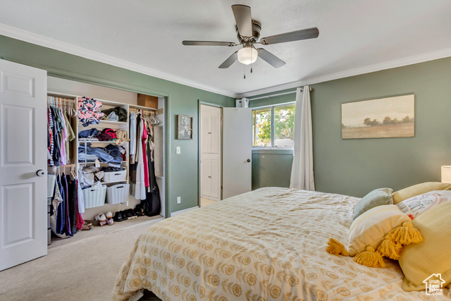 360 East Center Street Centerville, UT 84014 - Photo 16 of 41 Bedroom featuring crown molding, carpet floors, a closet, and a ceiling fan