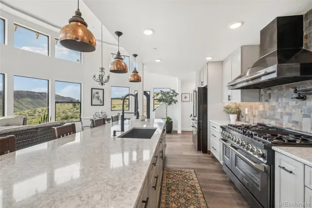 a view of a dining room with furniture large window and wooden floor