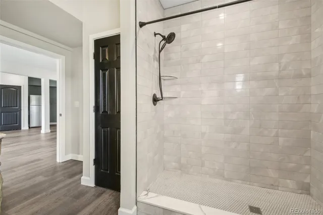 a bedroom with a large bed and a large window