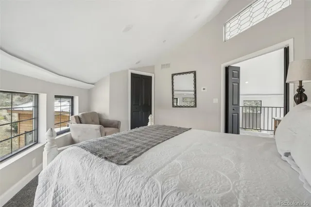 a view of an entryway with wooden floor and door