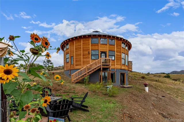 a front view of a house with stairs