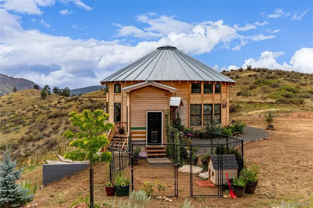 a house with a mountain in the background
