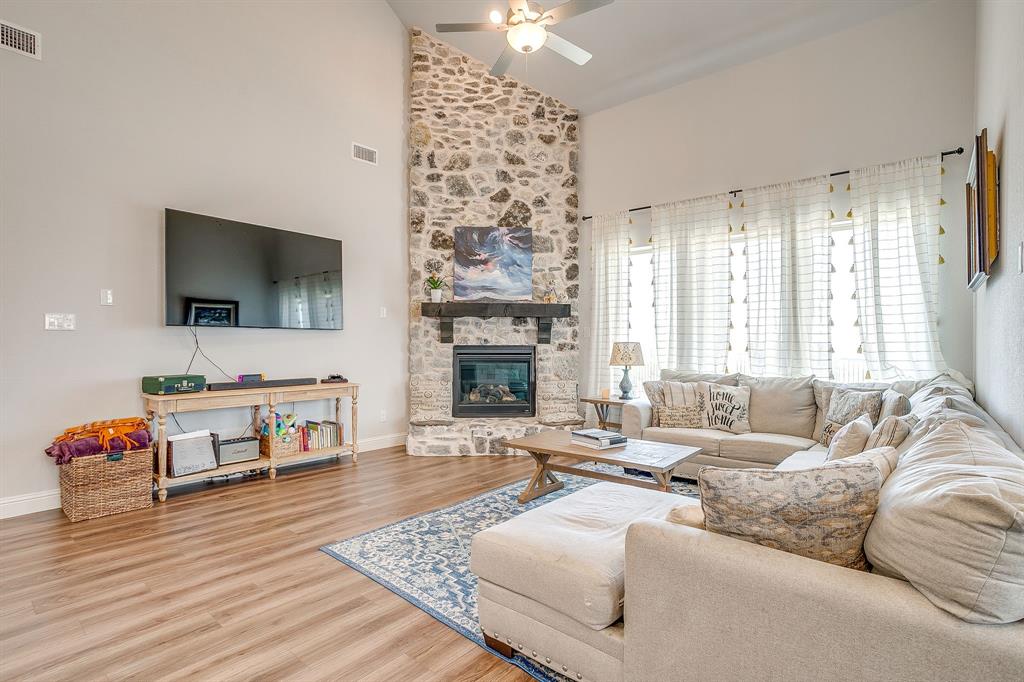 10371 Trail Ridge Drive Fort Worth, TX 76126 - Photo 11 of 35 a living room with furniture and a flat screen tv