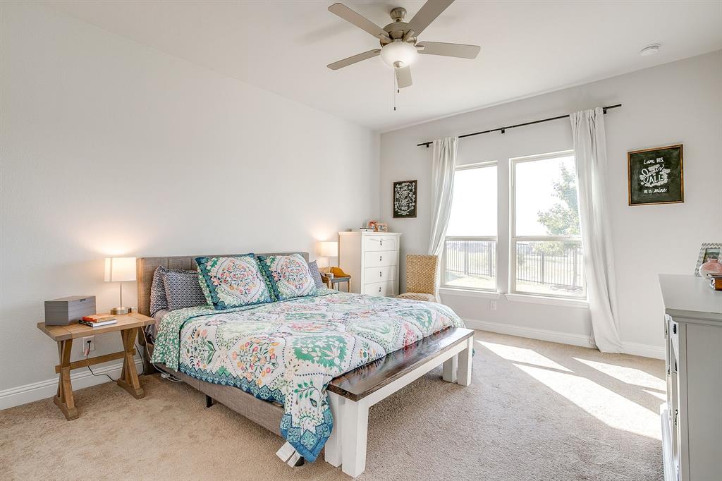 10371 Trail Ridge Drive Fort Worth, TX 76126 - Photo 13 of 35 a bedroom with a bed and a window