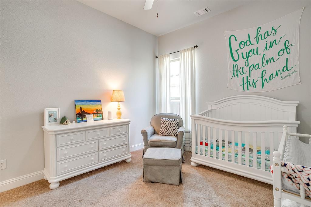 10371 Trail Ridge Drive Fort Worth, TX 76126 - Photo 22 of 35 a bedroom with a bed and a window
