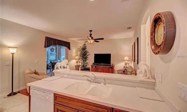 a spacious bathroom with a sink and a mirror
