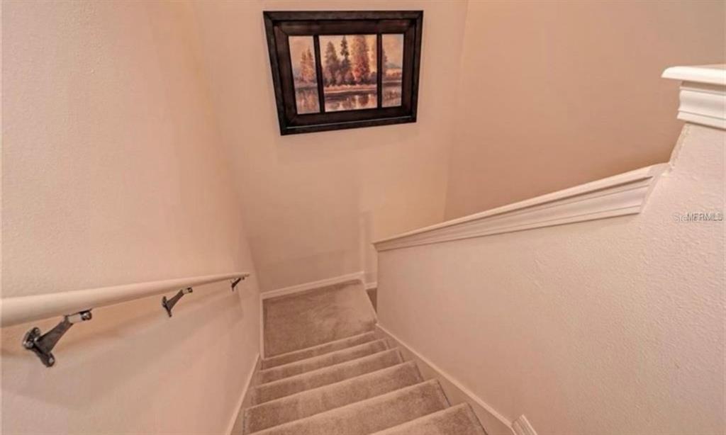 15108 Skip Jack Loop Lakewood Ranch, FL 34202 - Photo 13 of 23 a view of staircase with white walls