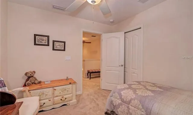 a bedroom with a bed and a cabinets