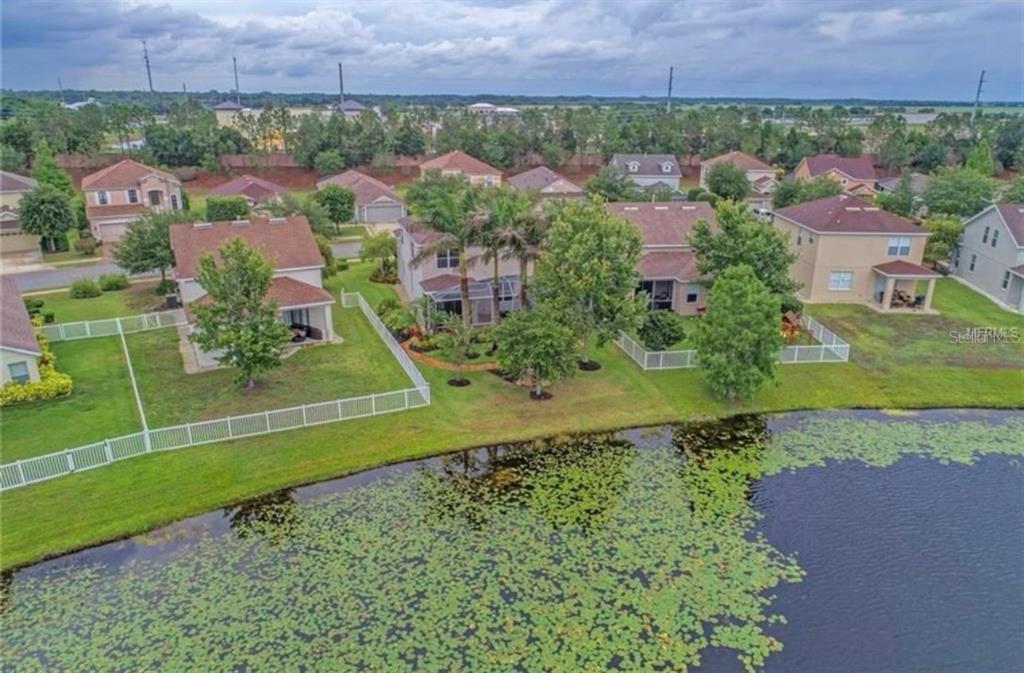 15108 Skip Jack Loop Lakewood Ranch, FL 34202 - Photo 23 of 23 an aerial view of residential house with outdoor space and trees all around
