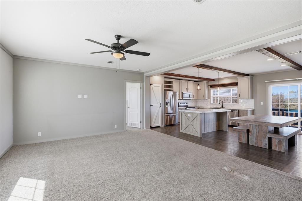151 Private Road 3814 Springtown, TX 76082 - Photo 3 of 29 a view of a livingroom with furniture and a ceiling fan