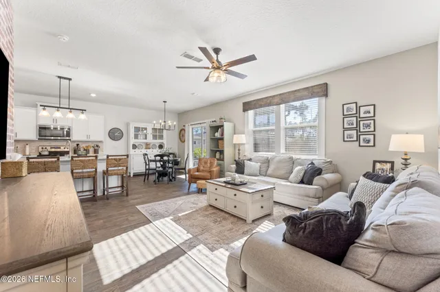 a bedroom with a bed and a chair