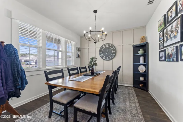 an aerial view of a house with a yard and outdoor seating