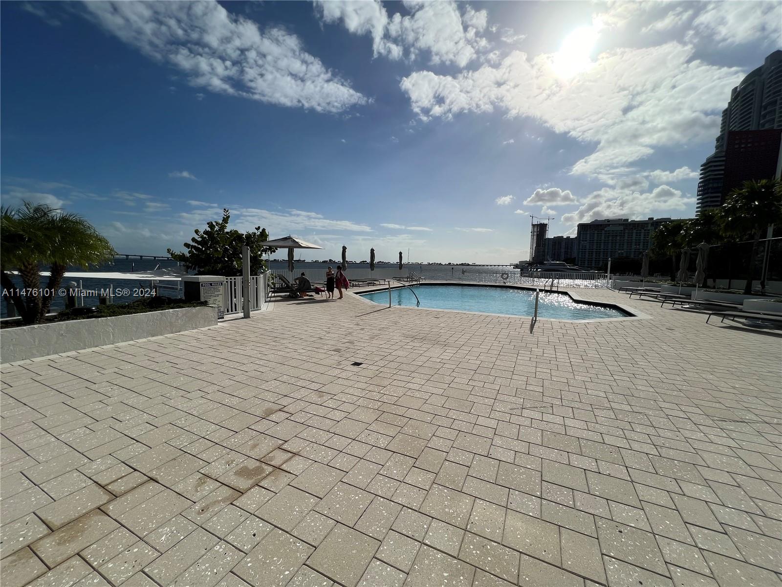 200 Southeast 15th Road, Unit 11F Miami, FL 33129 - Photo 22 of 22 a view of outdoor space with pool and lake view