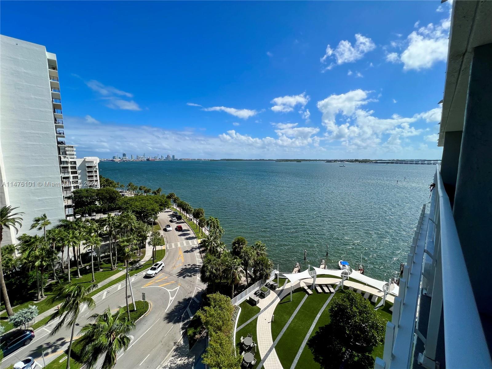 200 Southeast 15th Road, Unit 11F Miami, FL 33129 - Photo 3 of 22 a view of a lake with a yard