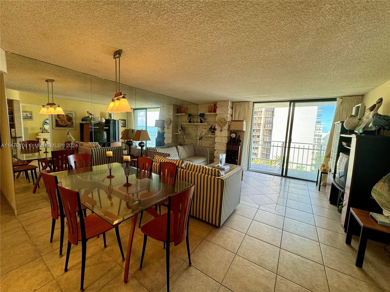 200 Southeast 15th Road, Unit 11F Miami, FL 33129 - Photo 6 of 22 a view of a dining room with furniture