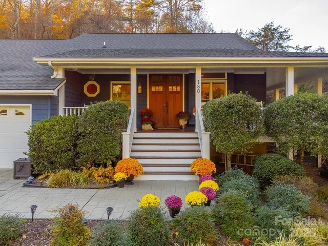 front view of house with potted plants